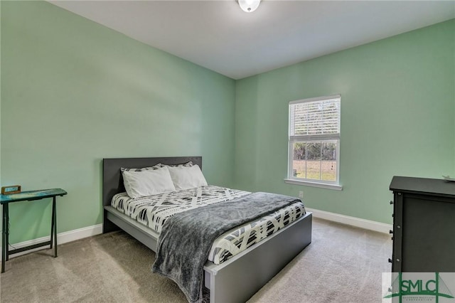 bedroom featuring carpet flooring and baseboards