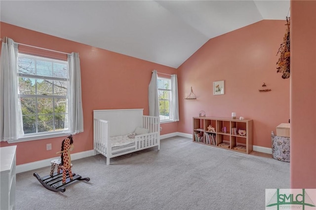 bedroom featuring lofted ceiling, carpet, and baseboards