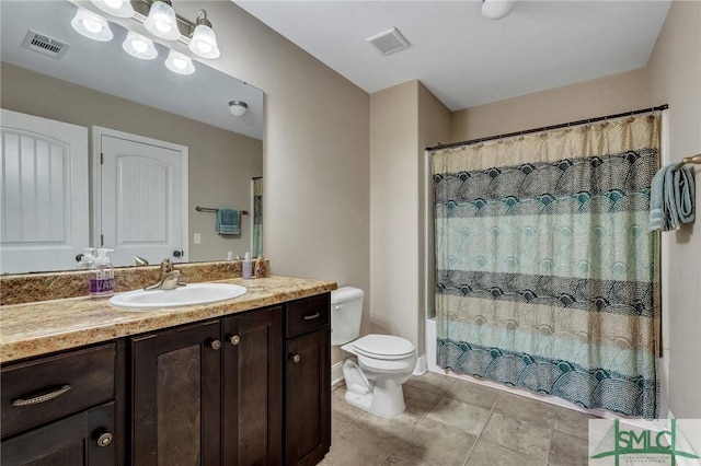 full bathroom featuring tile patterned flooring, visible vents, toilet, and vanity