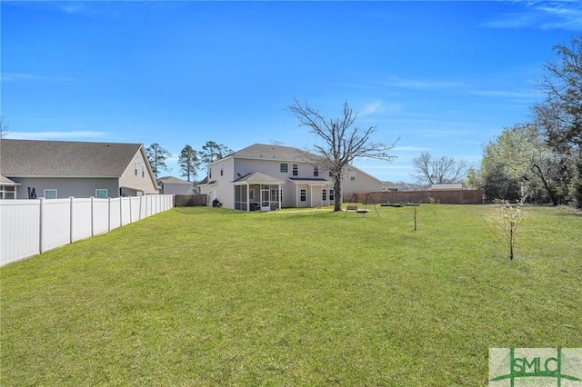 view of yard with a fenced backyard