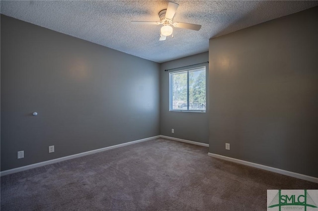 carpeted empty room with a textured ceiling, baseboards, and ceiling fan