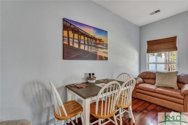 dining room featuring visible vents and wood finished floors