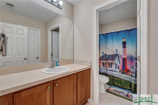 bathroom with tile patterned floors, visible vents, toilet, a shower with curtain, and vanity