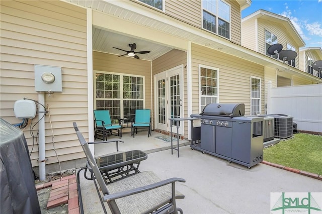 view of patio / terrace featuring central AC unit, ceiling fan, a grill, and fence