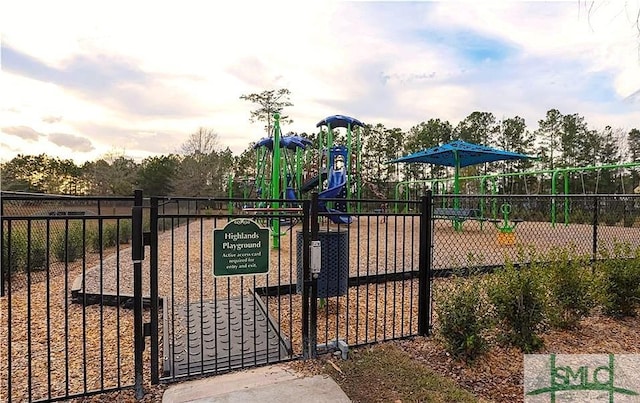 view of gate with fence