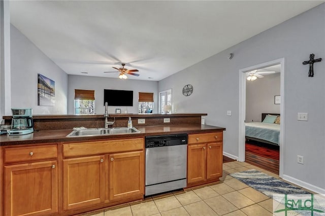 kitchen with dishwasher, plenty of natural light, a ceiling fan, and a sink