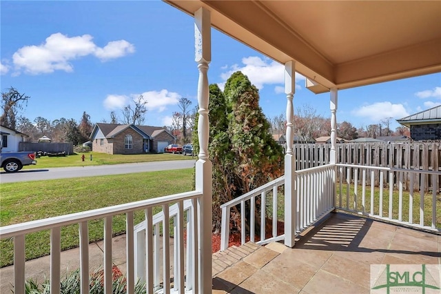 balcony with a residential view and covered porch