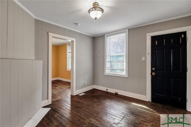 foyer featuring baseboards, dark wood-style floors, and ornamental molding