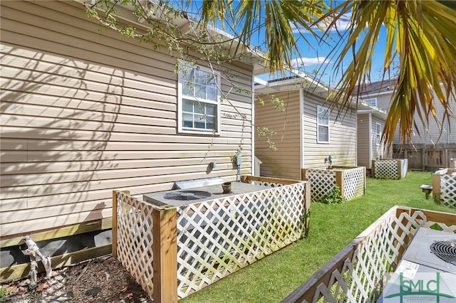 wooden deck with a yard and fence