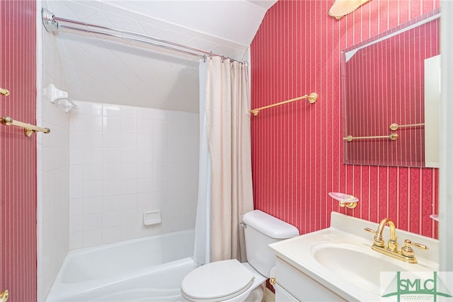 bathroom featuring wallpapered walls, shower / bath combination with curtain, toilet, and vanity