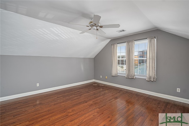 additional living space featuring visible vents, baseboards, hardwood / wood-style floors, and a ceiling fan