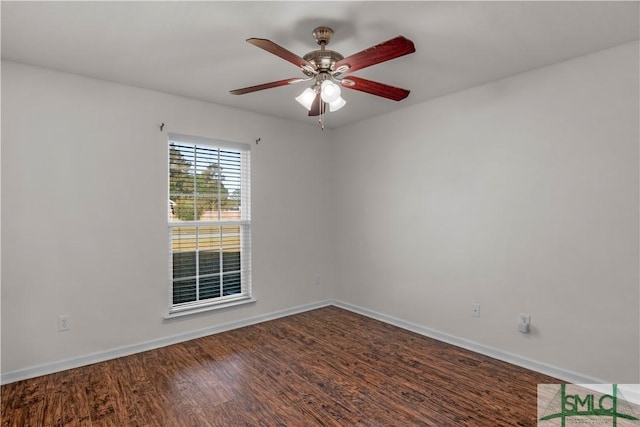 unfurnished room featuring ceiling fan, baseboards, and wood finished floors