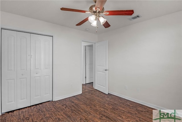 unfurnished bedroom featuring visible vents, a ceiling fan, wood finished floors, a closet, and baseboards