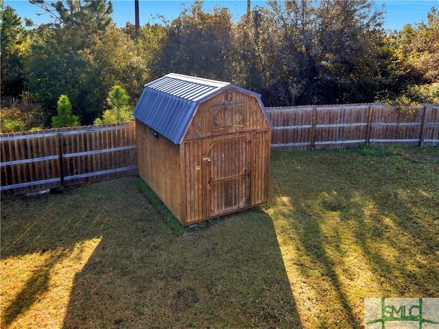 view of shed with a fenced backyard