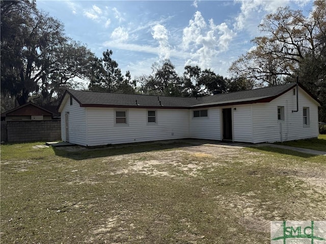 rear view of property with fence