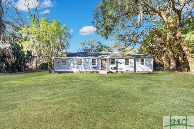 ranch-style home featuring a front yard