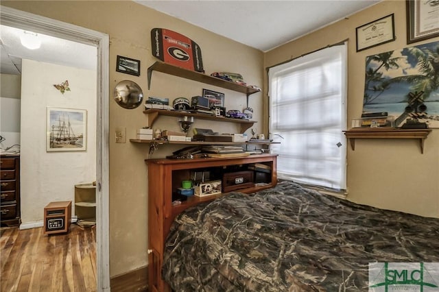 bedroom with wood finished floors