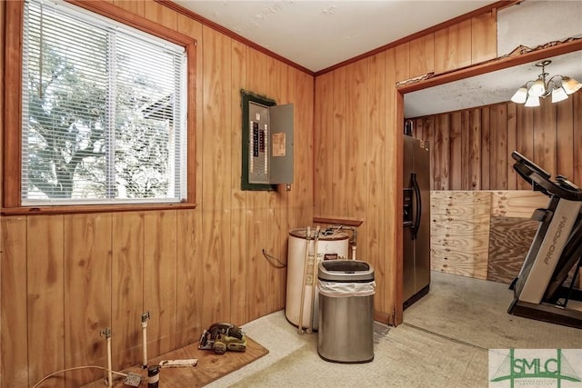 interior space featuring electric panel, wood walls, and crown molding