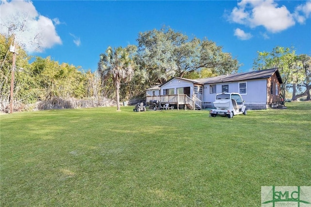 view of yard featuring a wooden deck