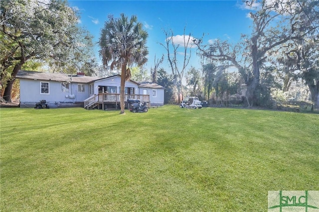 view of yard with a wooden deck