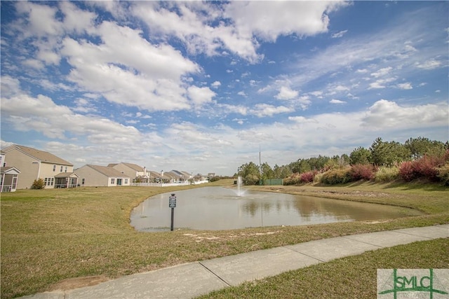 exterior space featuring a water view, a residential view, and sidewalks