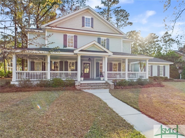 view of front of property with a porch and a front yard