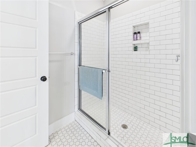 bathroom with a shower stall