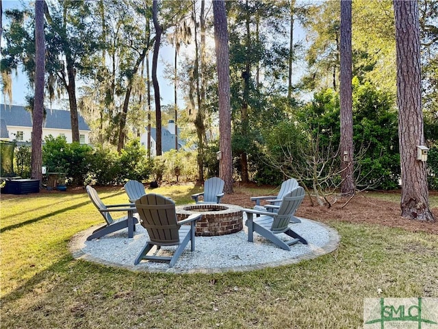 view of yard with a patio and a fire pit