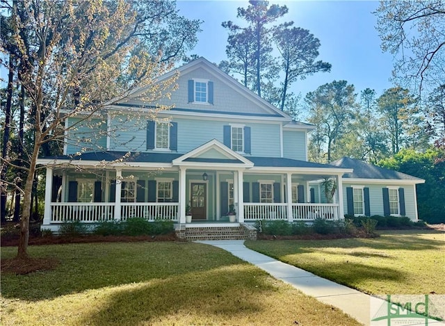 view of front of house with covered porch and a front lawn