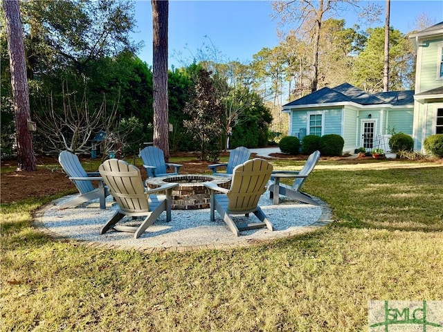 view of yard with a patio area and a fire pit