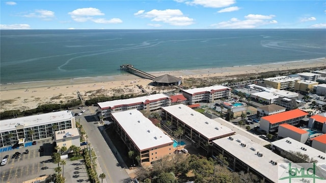 bird's eye view featuring a view of the beach and a water view