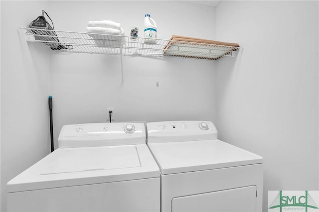 laundry room with laundry area and washer and clothes dryer