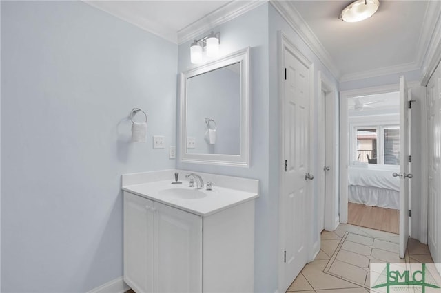 ensuite bathroom with tile patterned flooring, vanity, ensuite bathroom, and ornamental molding