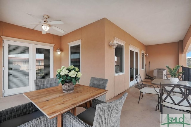 view of patio / terrace featuring french doors, central AC, outdoor dining area, and ceiling fan