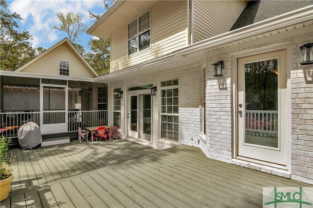 181 Kolic Helmey Rd, Guyton, GA 31312 - wooden deck featuring a sunroom