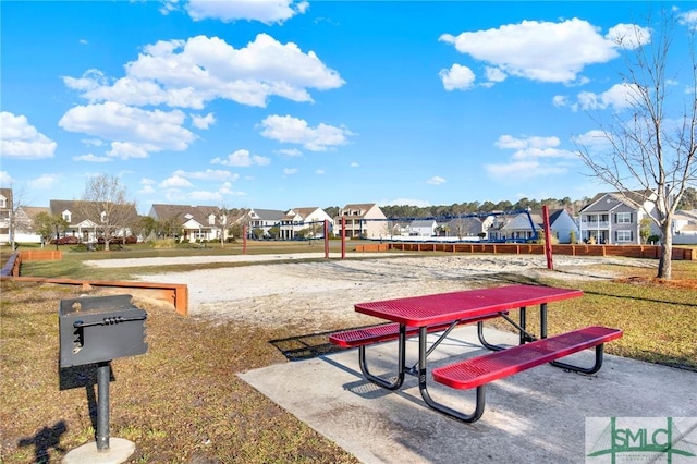 view of home's community featuring a yard, a residential view, and volleyball court