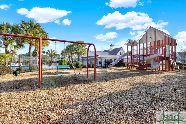 community jungle gym featuring fence