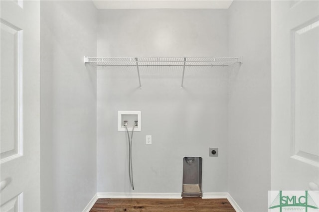 laundry area with baseboards, washer hookup, laundry area, dark wood-style floors, and electric dryer hookup