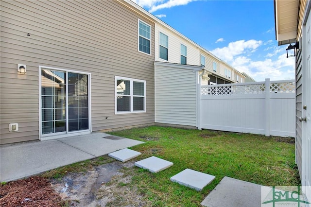 view of yard featuring a patio and fence