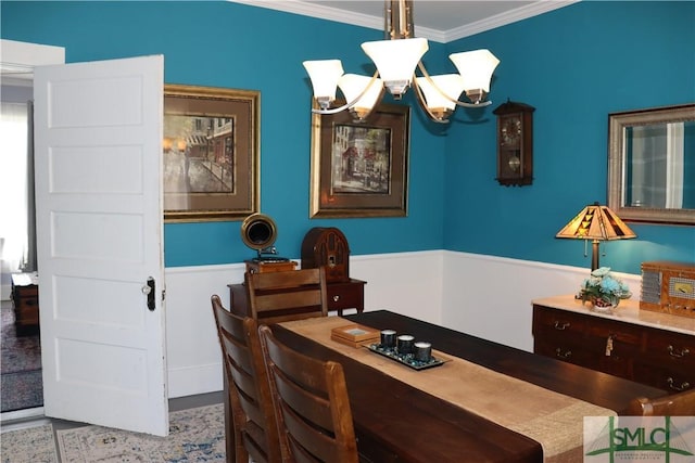 dining room featuring crown molding