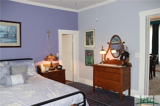 bedroom featuring crown molding