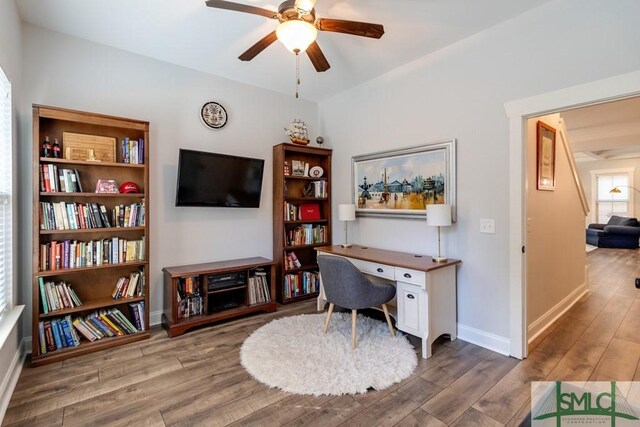 office with wood finished floors, ceiling fan, and baseboards