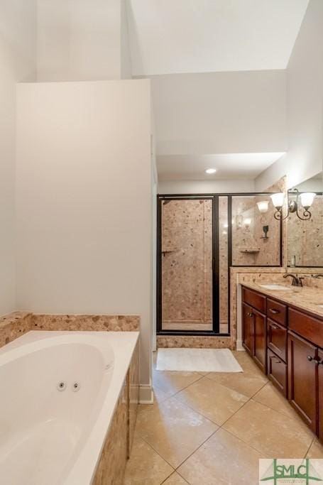 full bath featuring tile patterned flooring, a sink, a stall shower, a jetted tub, and double vanity