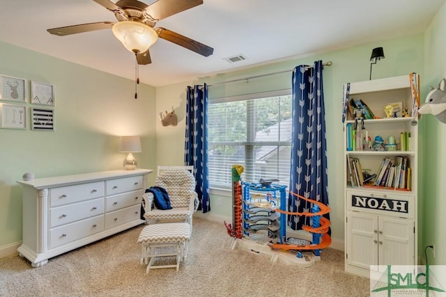 game room featuring baseboards, a ceiling fan, visible vents, and carpet floors
