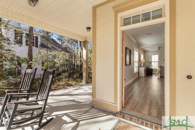 entrance to property featuring concrete block siding