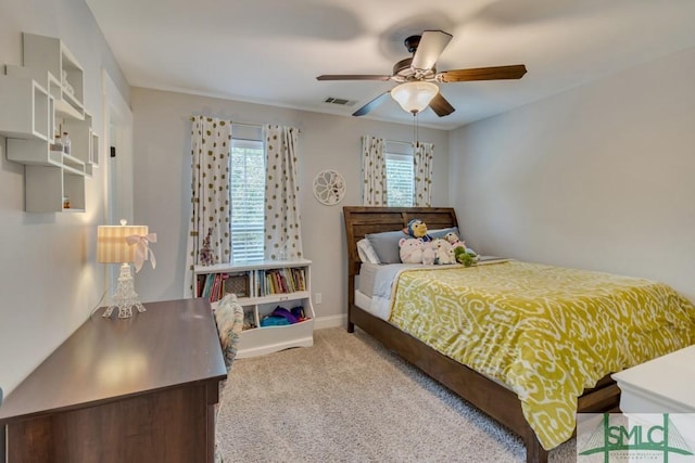bedroom featuring a ceiling fan, baseboards, carpet, and visible vents