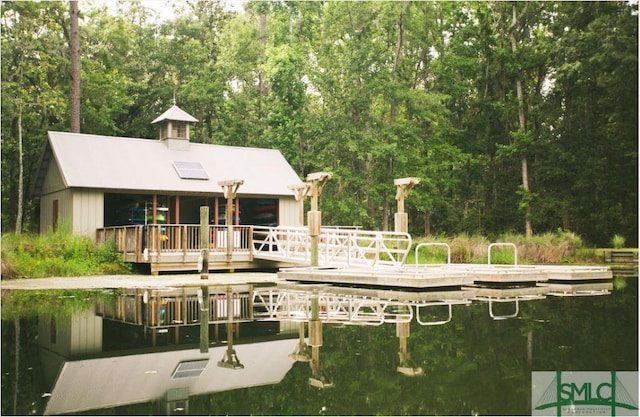 back of house with a deck