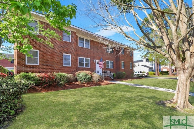 601 E 53rd St, Savannah, GA 31405 - view of front of home featuring brick siding and a front lawn