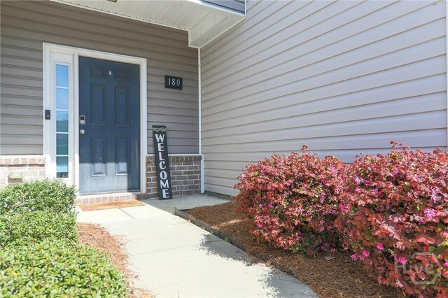180 Kepler Loop, Richmond Hill, GA 31324 - doorway to property featuring covered porch