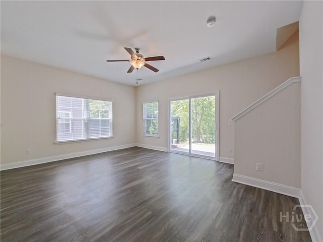 180 Kepler Loop, Richmond Hill, GA 31324 - unfurnished room with ceiling fan, dark wood-type flooring, baseboards, and a smoke detector